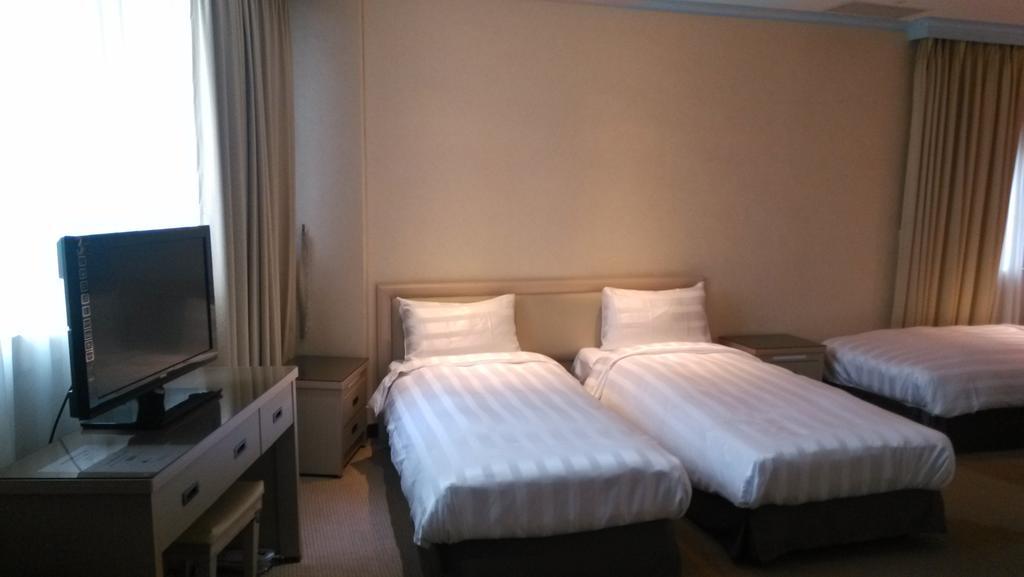 A Casa Hotel Taoyuan Quarto foto