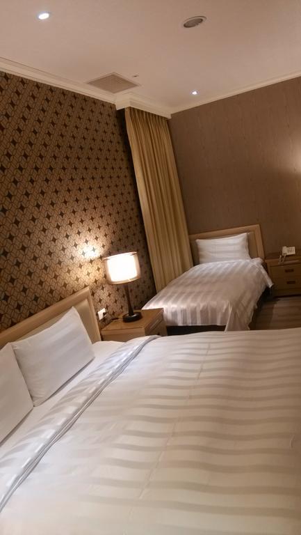 A Casa Hotel Taoyuan Quarto foto